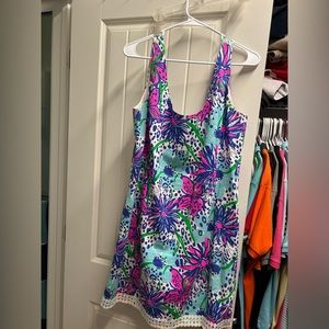 Lilly Pulitzer Shift dress. Zips down the back. Detail around the bottom.